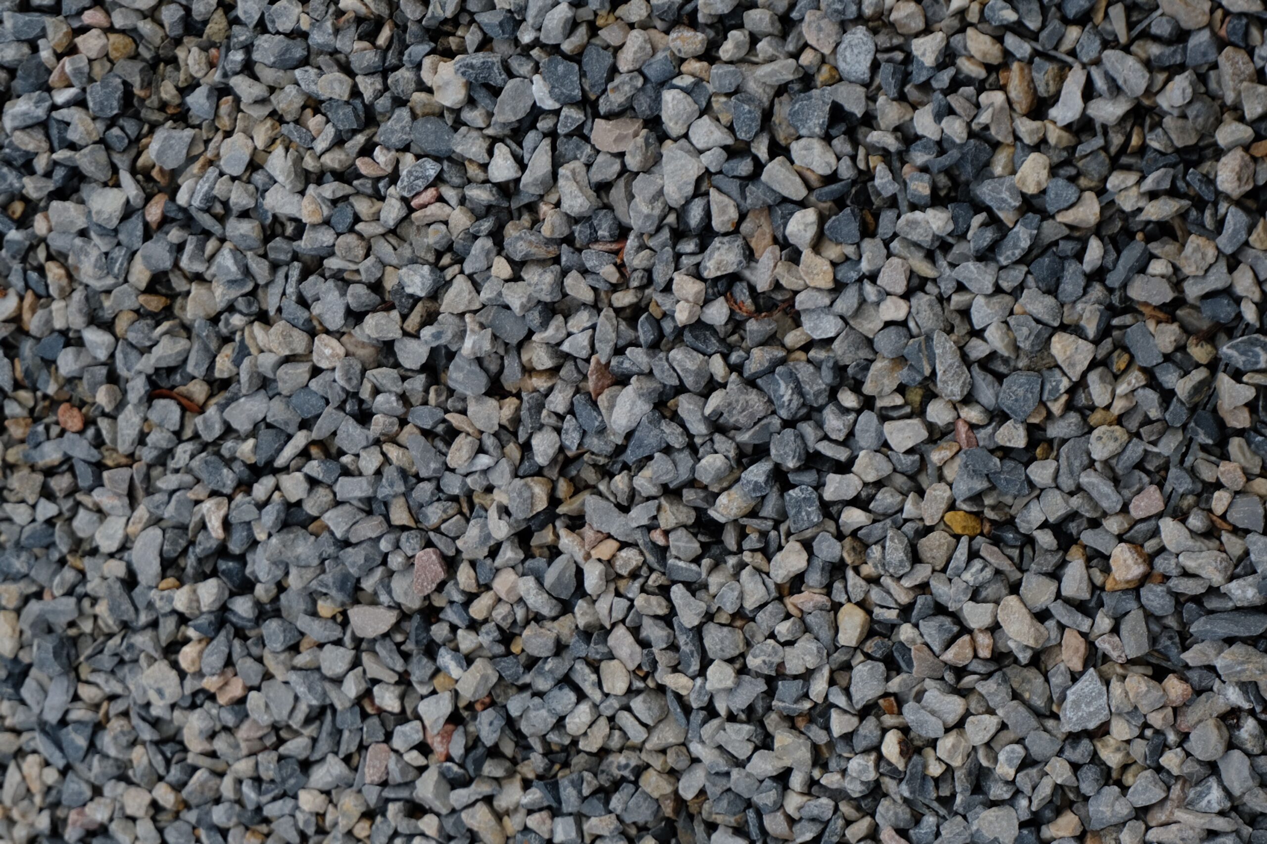High-resolution image of crushed gravel stones, ideal for construction and landscaping projects.